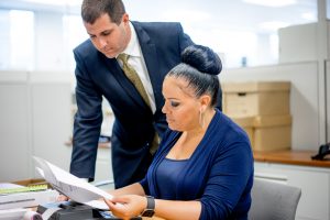 Man and woman reviewing papers