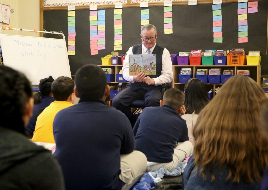 Mayor Kenney reading book to elementary-aged students