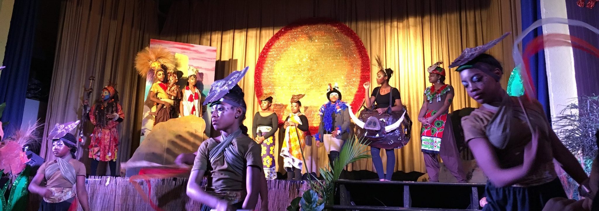 students performing in the lion king play