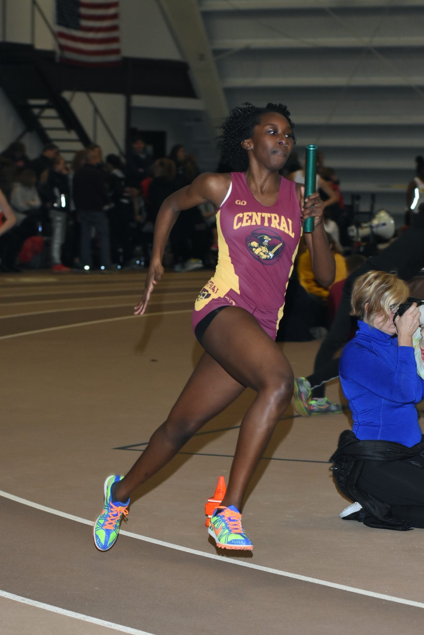 Girl running on indoor track