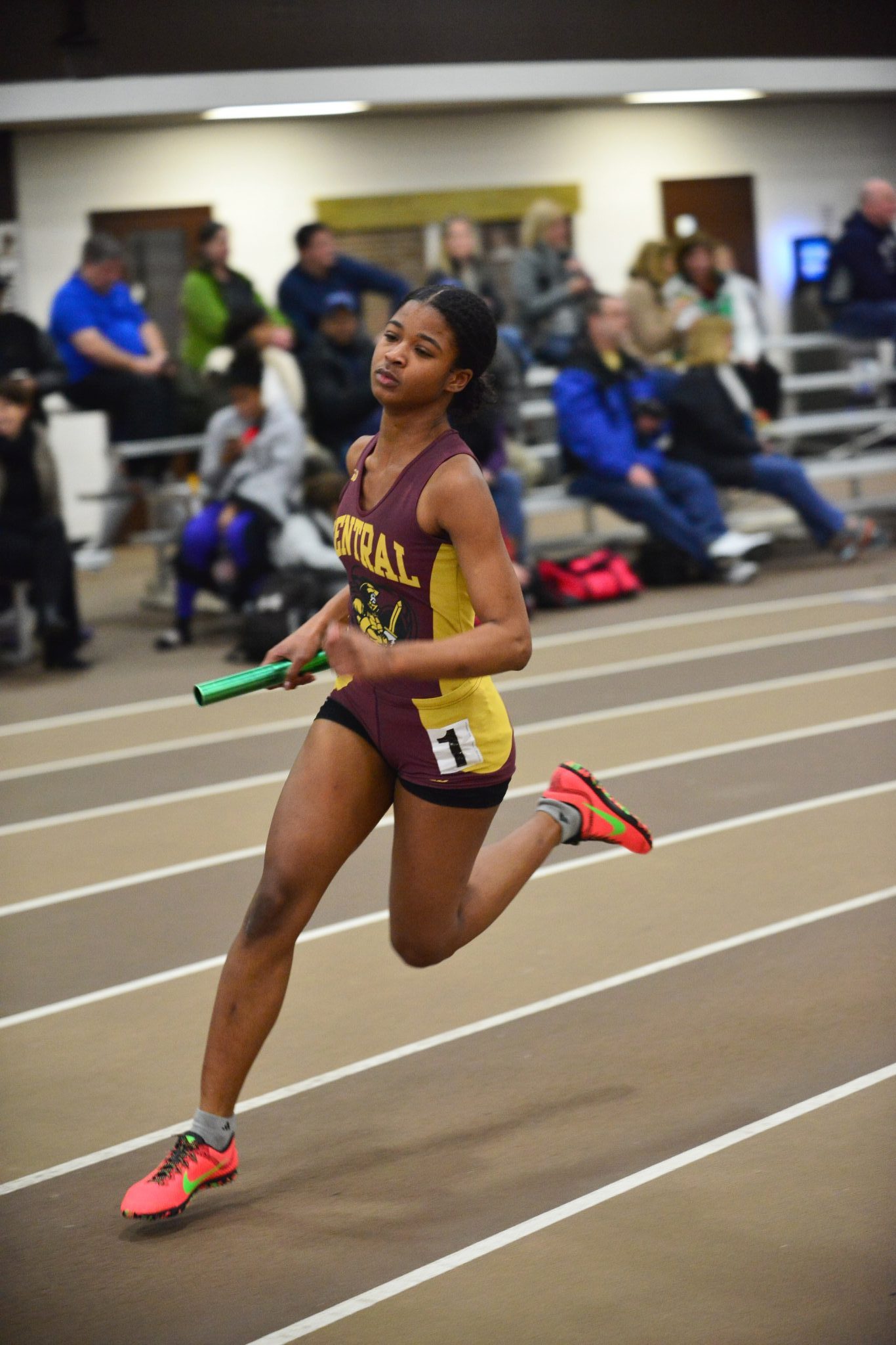 Girl running with baton