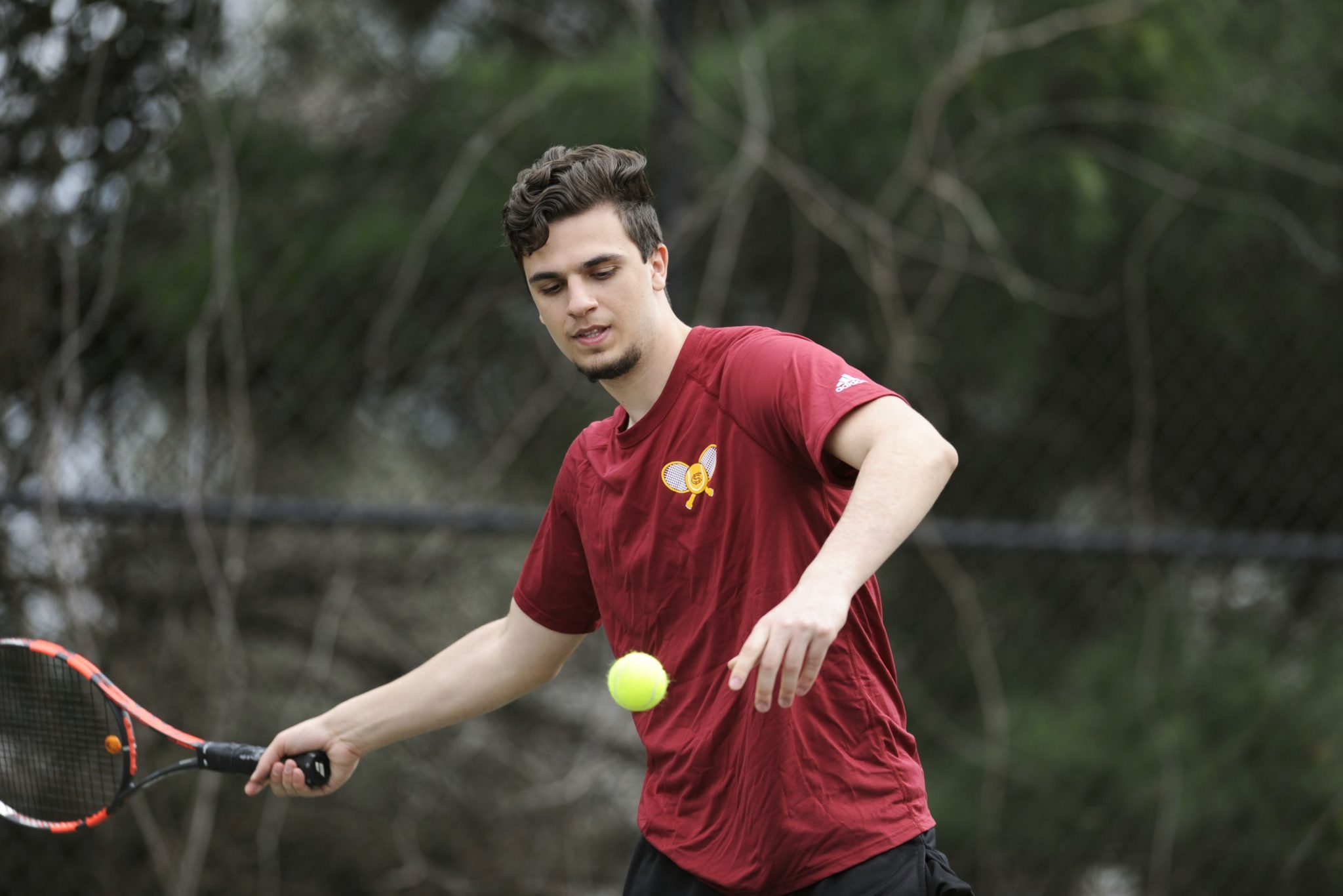 Player eyeing ball before hitting it