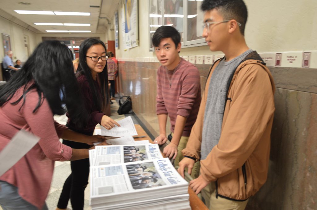 Students getting copy of the College Fair Guide