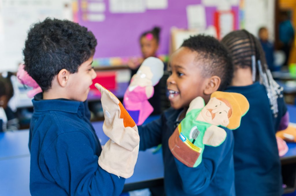 Kids playing with puppets