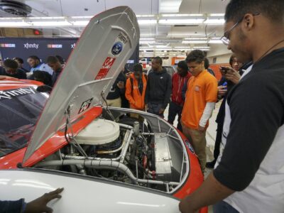 NASCAR Xfinity Cup drivers Bubba Wallace, Brennan Poole and Ryan Reed visit the School District of Philadelphia’s A. Phillip Randolph Technical High School, Tuesday May 17, 2016, in Philadelphia.  (Comcast Photo/ Joseph Kaczmarek)