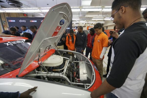 NASCAR Xfinity Cup drivers Bubba Wallace, Brennan Poole and Ryan Reed visit the School District of Philadelphia’s A. Phillip Randolph Technical High School, Tuesday May 17, 2016, in Philadelphia.  (Comcast Photo/ Joseph Kaczmarek)
