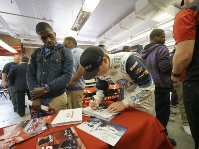 NASCAR Xfinity Cup drivers Bubba Wallace, Brennan Poole and Ryan Reed visit the School District of Philadelphia’s A. Phillip Randolph Technical High School, Tuesday May 17, 2016, in Philadelphia.  (Comcast Photo/ Joseph Kaczmarek)