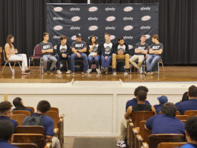 Drivers from NASCAR Next Class, a program for the next generation of race car drivers, spend time visiting with students from Mastbaum High School in the Kensington section of Philadelphia, Wednesday Sept. 27, 2017.  (Comcast Photo/ Joseph Kaczmarek)