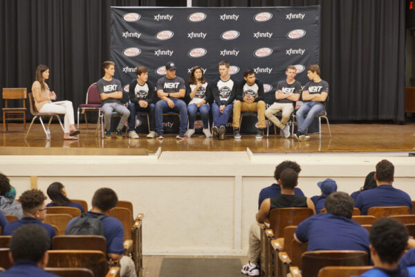 Drivers from NASCAR Next Class, a program for the next generation of race car drivers, spend time visiting with students from Mastbaum High School in the Kensington section of Philadelphia, Wednesday Sept. 27, 2017.  (Comcast Photo/ Joseph Kaczmarek)