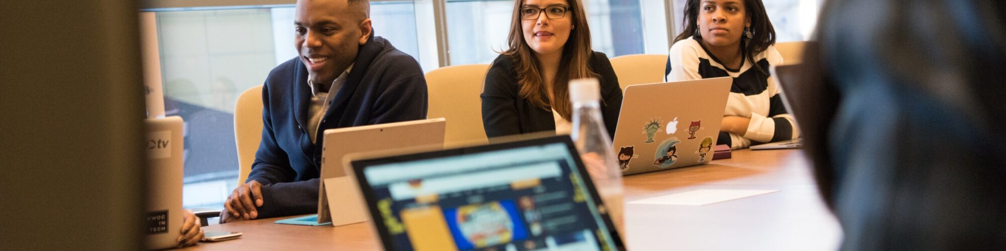 pexels-christina-morillo-1181405 a group of businesspeople meet at a conference table