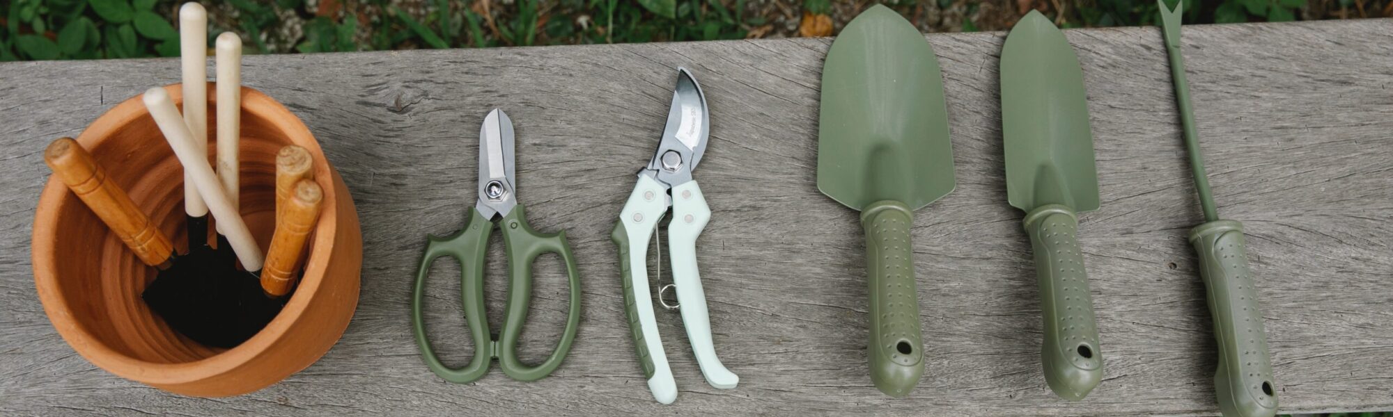 gardening tools are placed in a row