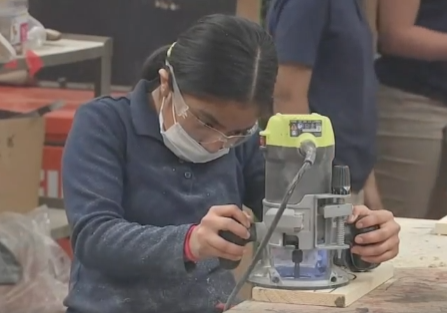 Mayfair middle schooler working a router