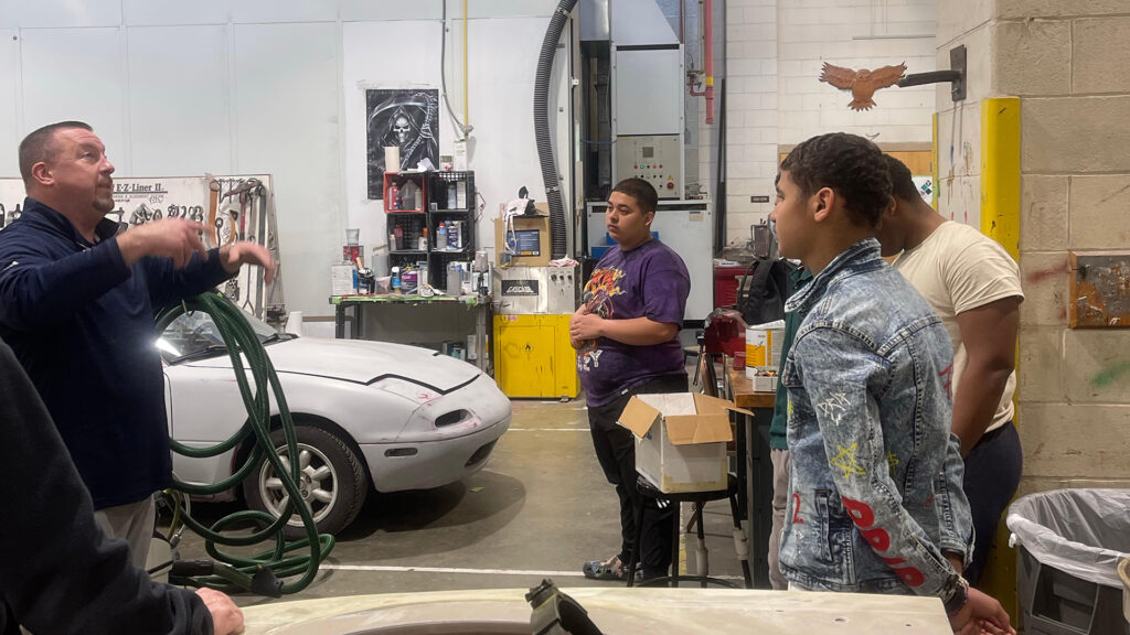 CTE auto collision students listening to guest speaker