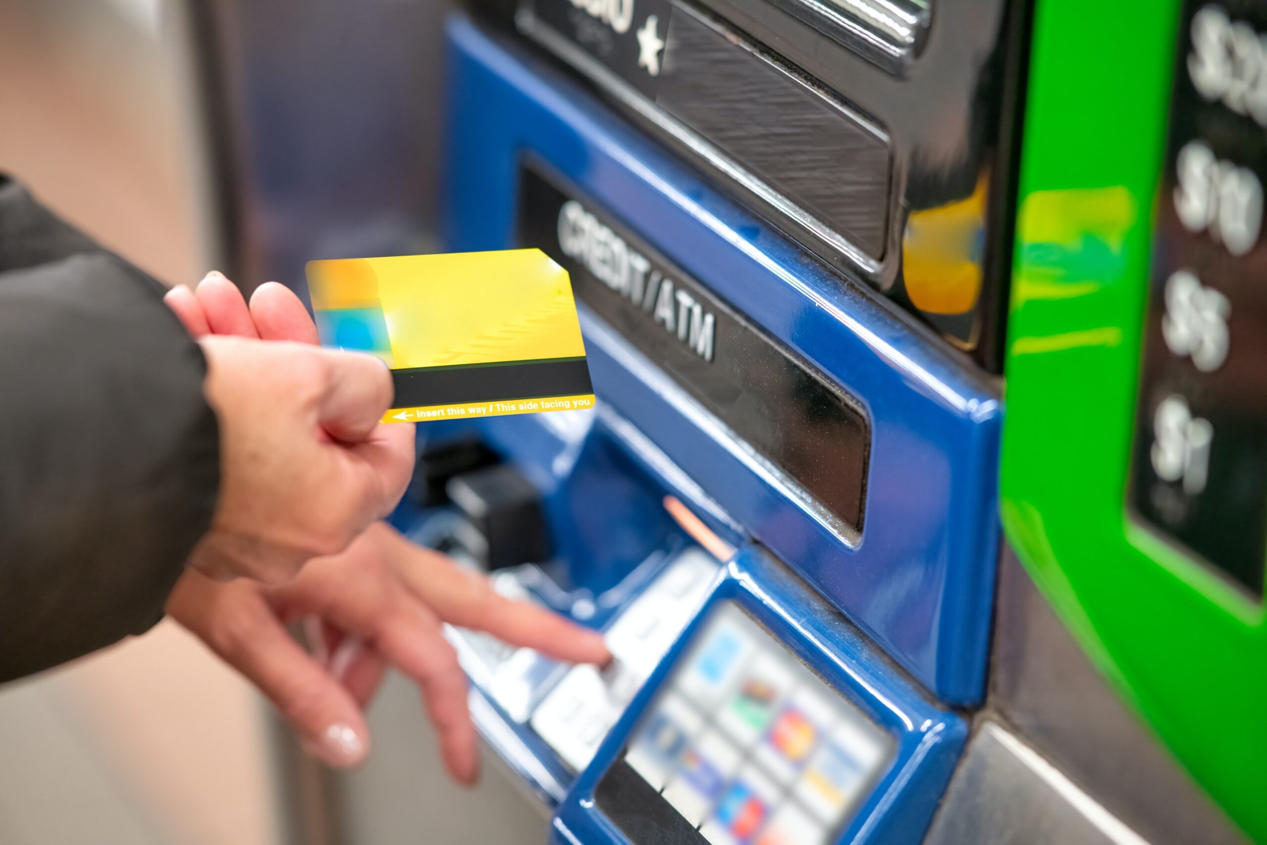 close up of a person at a machine that refills credits in their card