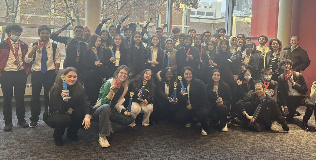 students from George Washington HS pose for a group photo