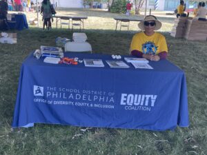 Sia one of our Equity Training Specialists Tabling at a Bus Tour Event