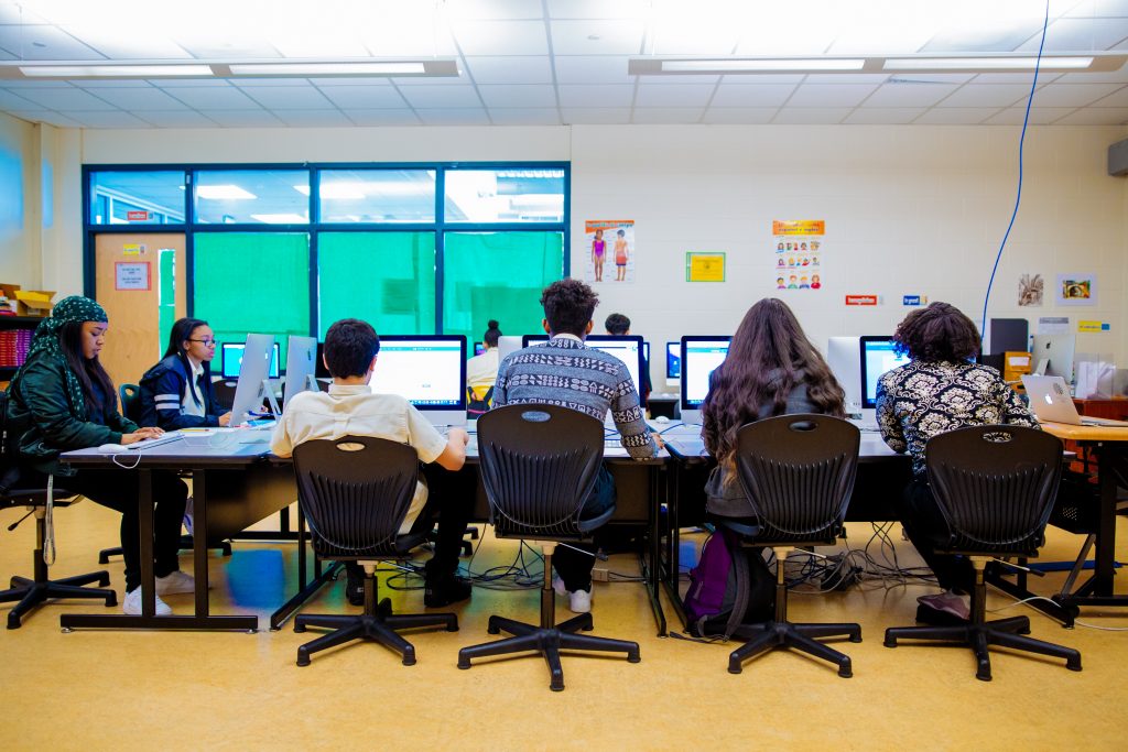 Image of high school students using desktop computers in a computer lab