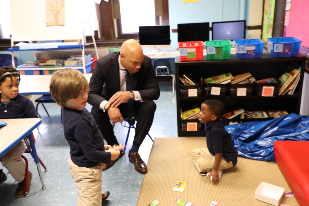 Dr. Hite talks with kindergarteners on the carpet