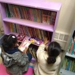 Children pick out books at the new community library