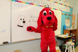 Clifford with portrait of himself at Decatur