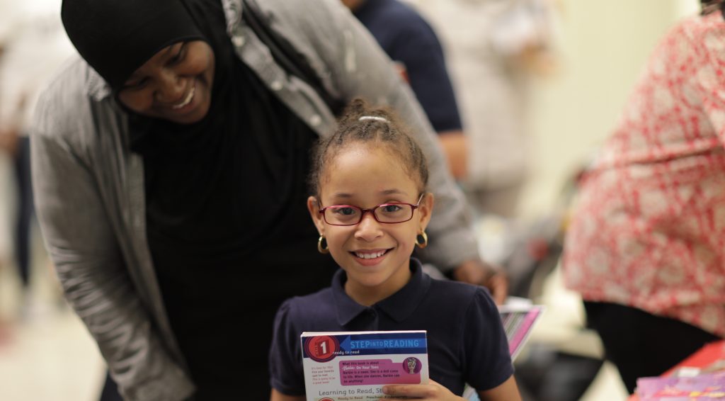 Happy child holding a book