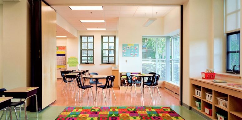 An empty, clean, well-lit classroom, awaiting for eager young minds.