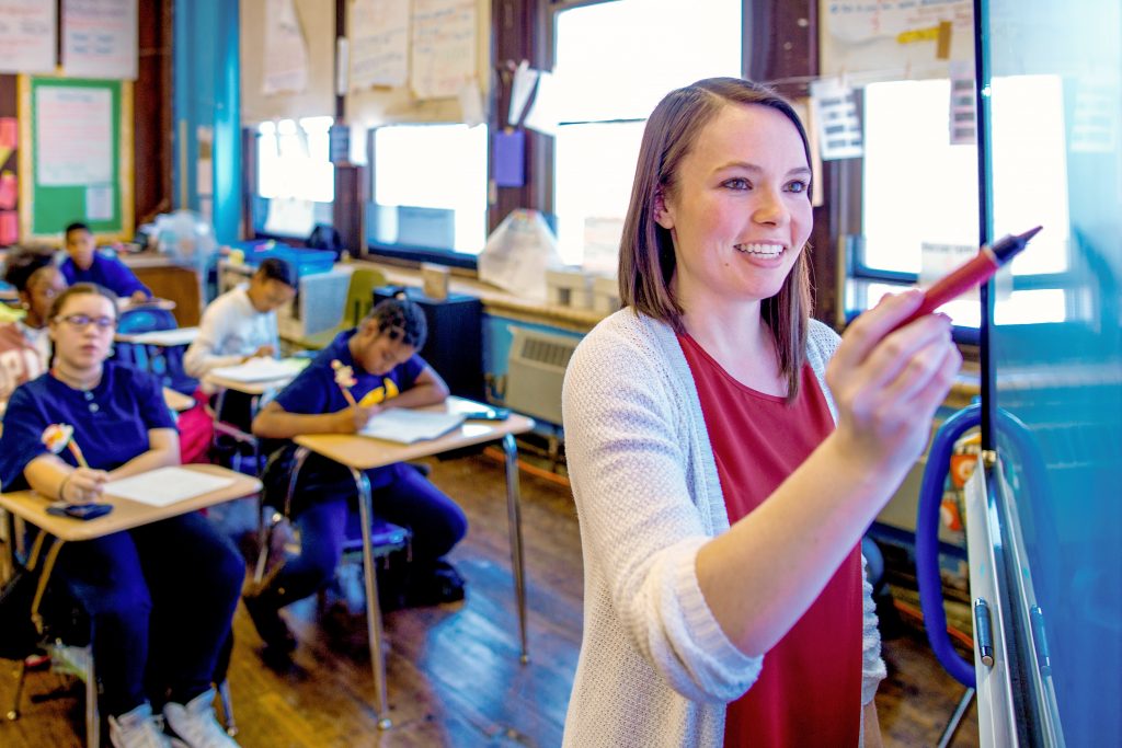 Teacher using a smart board