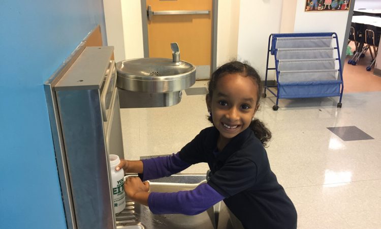 Student using hydration station