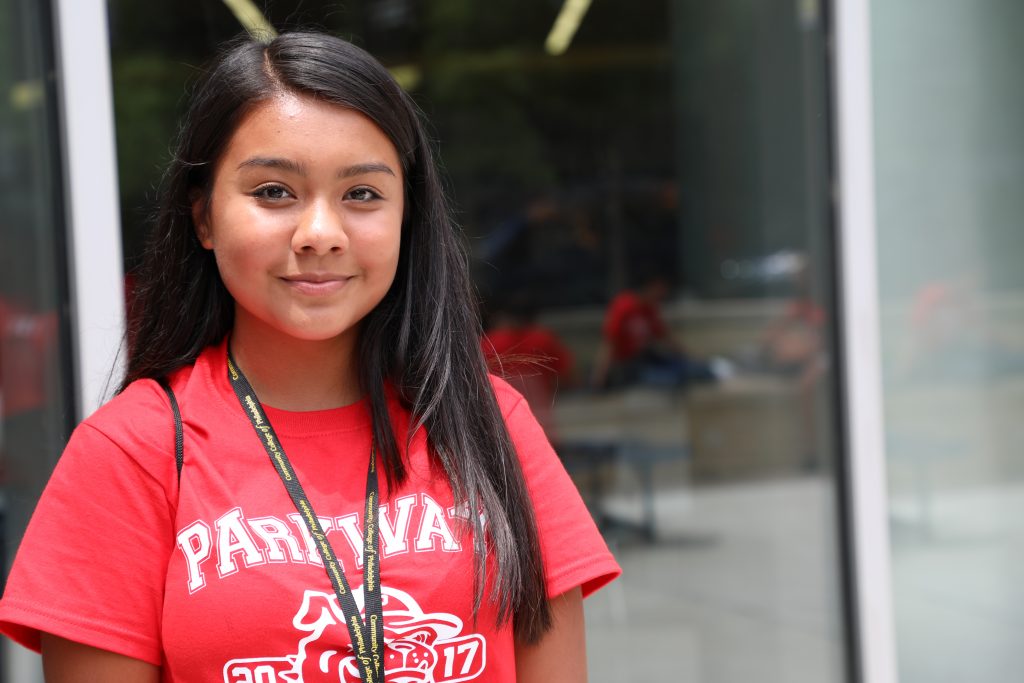 Smiling female student in red shirt