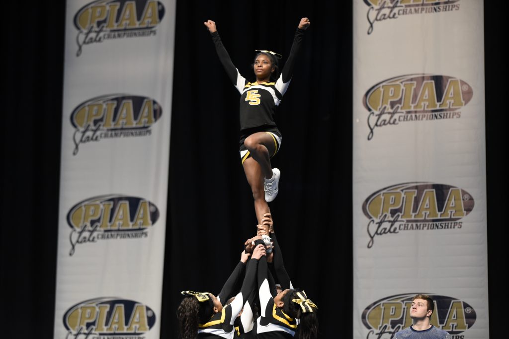 Cheerleader at the top of pyramid