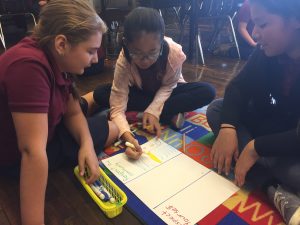 students working on the rug