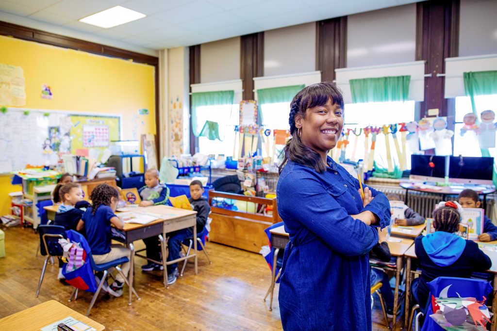 teacher standing in classroom