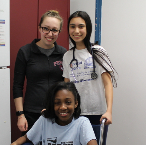 School Nurse with students in nurse's office