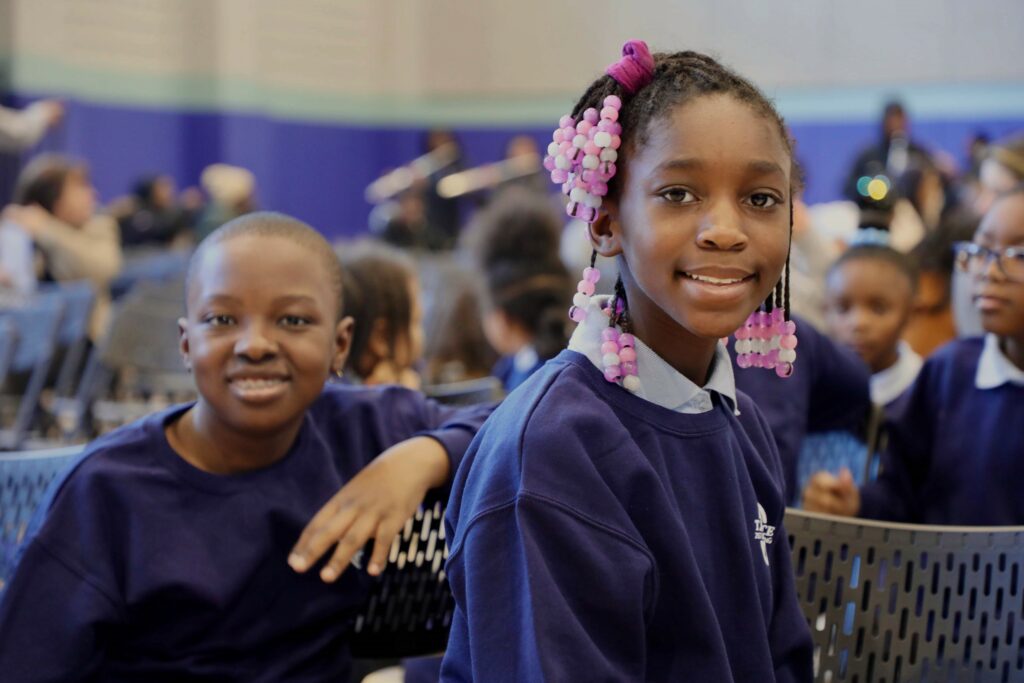 Two SDP students at a school assembly