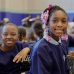 Two SDP students at a school assembly