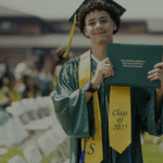 SDP Class of 2025 graduate holds up his diploma after the graduation ceremony