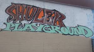 Painted Wall that says Shuler Playground