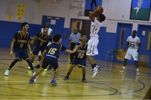 Roxborough Boys Basketball team layup shot against Esperanza