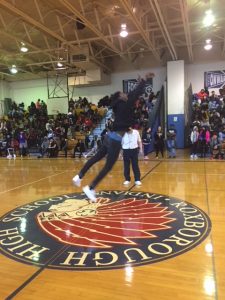 Student taking a shot in the Half court contest