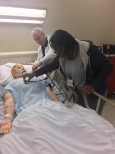 Student learning to measure heart rate at Drexel Simulation lab