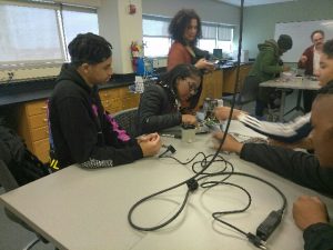 Students working on pulse oximeters int he CCP labs in the BMET program