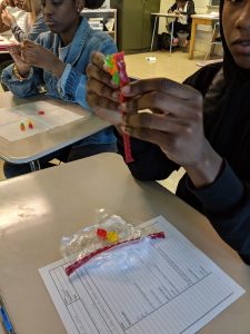 Students building DNA models with candy