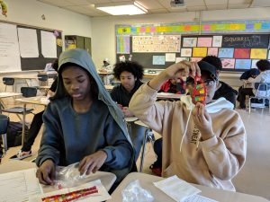 Students building DNA models with candy