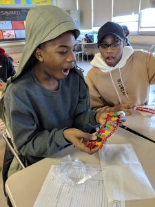 Students building DNA models with candy