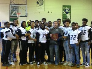 Coach Micheal Stanley celebrating with his team