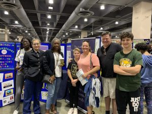 Ms. Jenkins and students at High School Fair