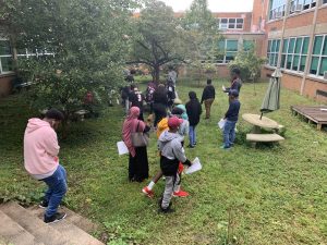 Environmental science students studing biodiversity in the courtyard