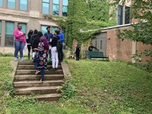 Environmental science students studing biodiversity in the courtyard