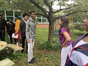 Environmental science students studing biodiversity in the courtyard