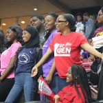 Students wearing college shirts